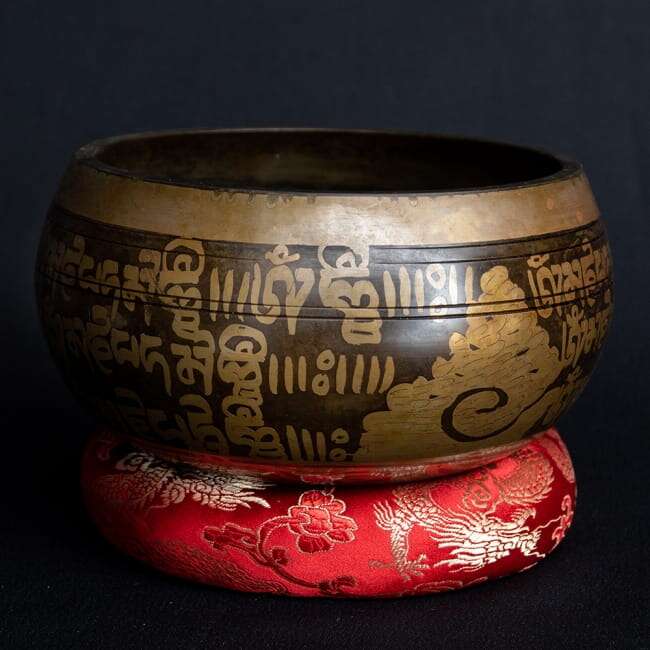 Tibetan singing bowl with hand-carved pattern